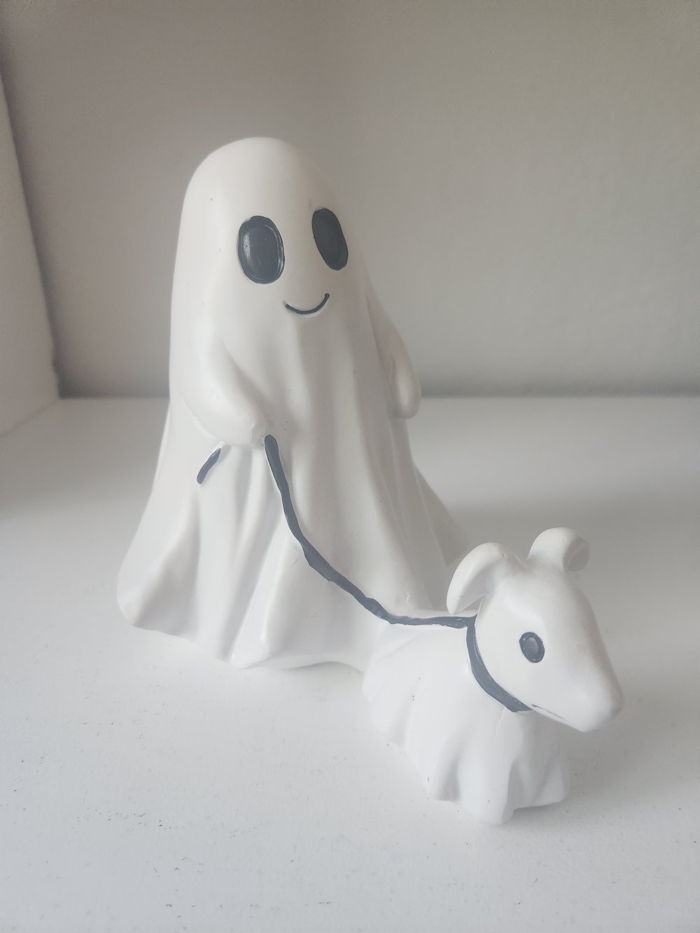 White Resin Ghost Figurine Walking A Ghosr Dog